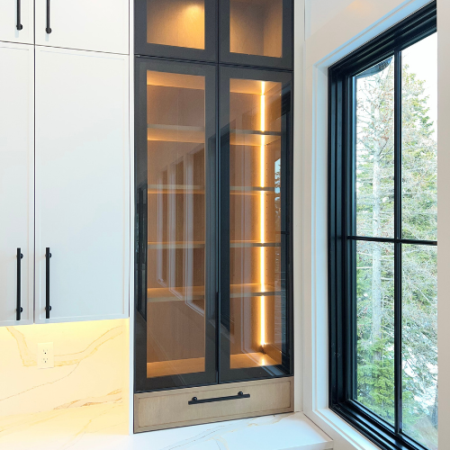showroom bathroom cabinet, black cabinets with orange lighting in it